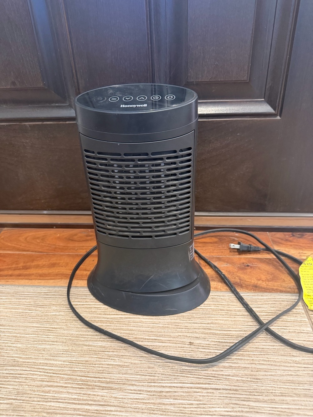 Honeywell Black Tower Space Heater under desk